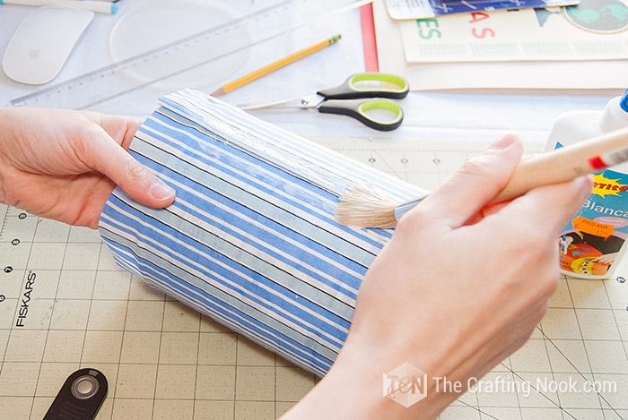 applying a little more glue on top of the fabric around the entire fabric
