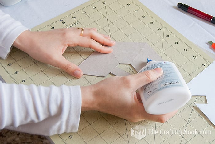 view applying glue on the cardboard pattern
