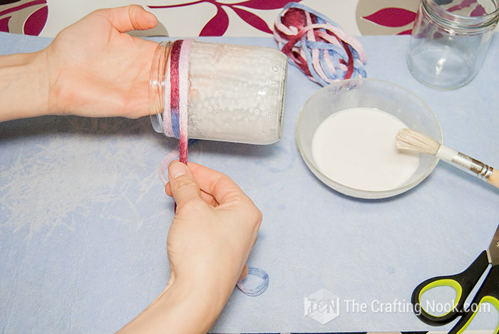 start wrapping the jar-neck with yarn