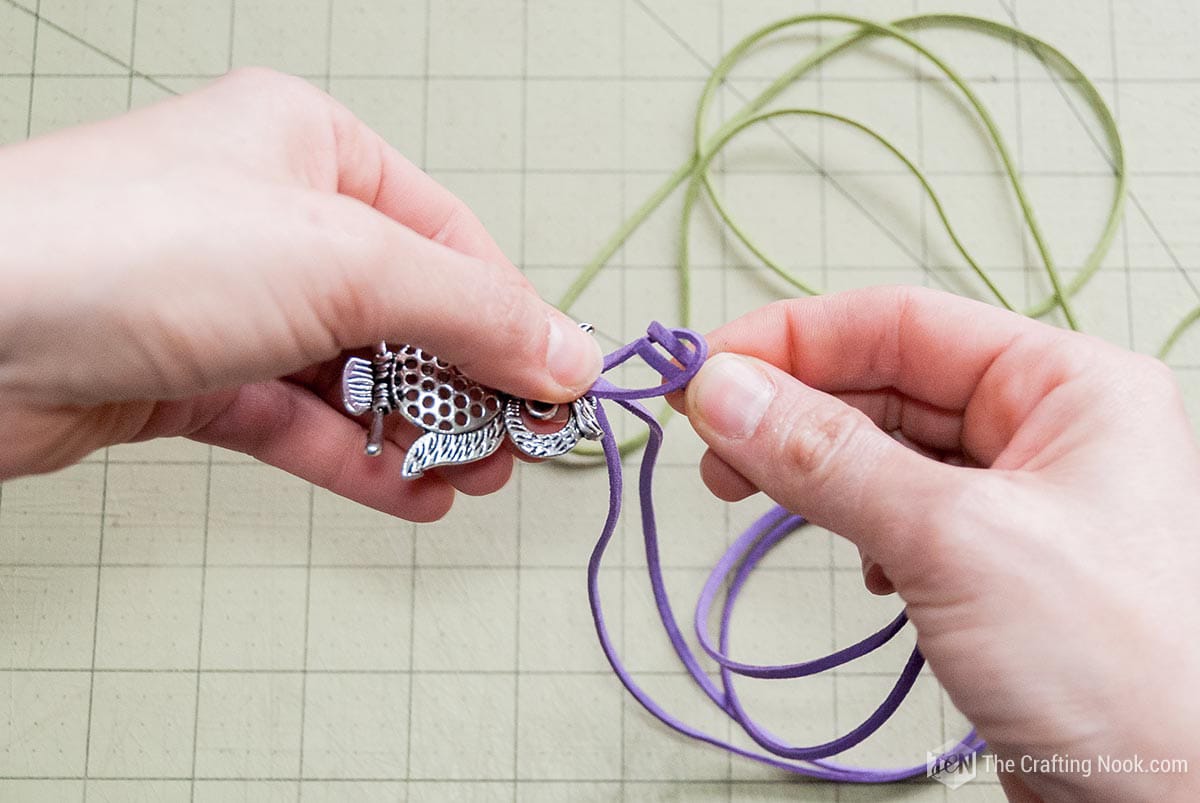 inserting the other end of the cord (both ends) through the folded end of the cord