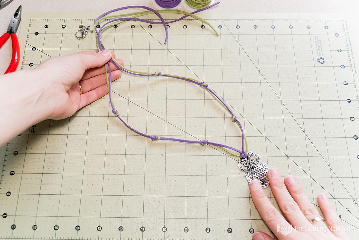 showing the knots made along the length of the necklace