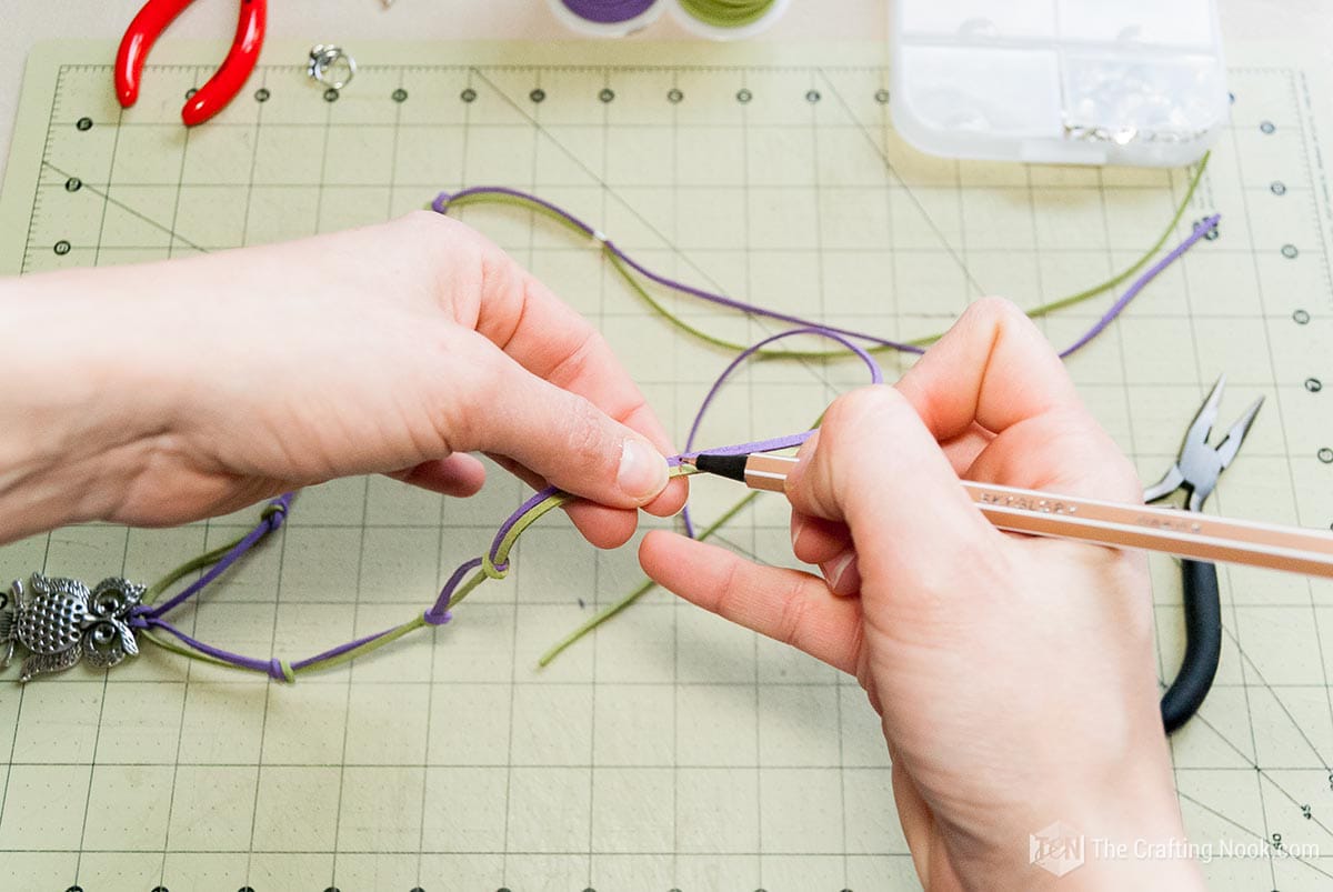 marking guide with a pen to put the brooch