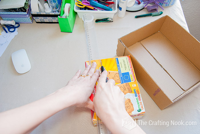 Cutting the boxes to the desired height with a knife