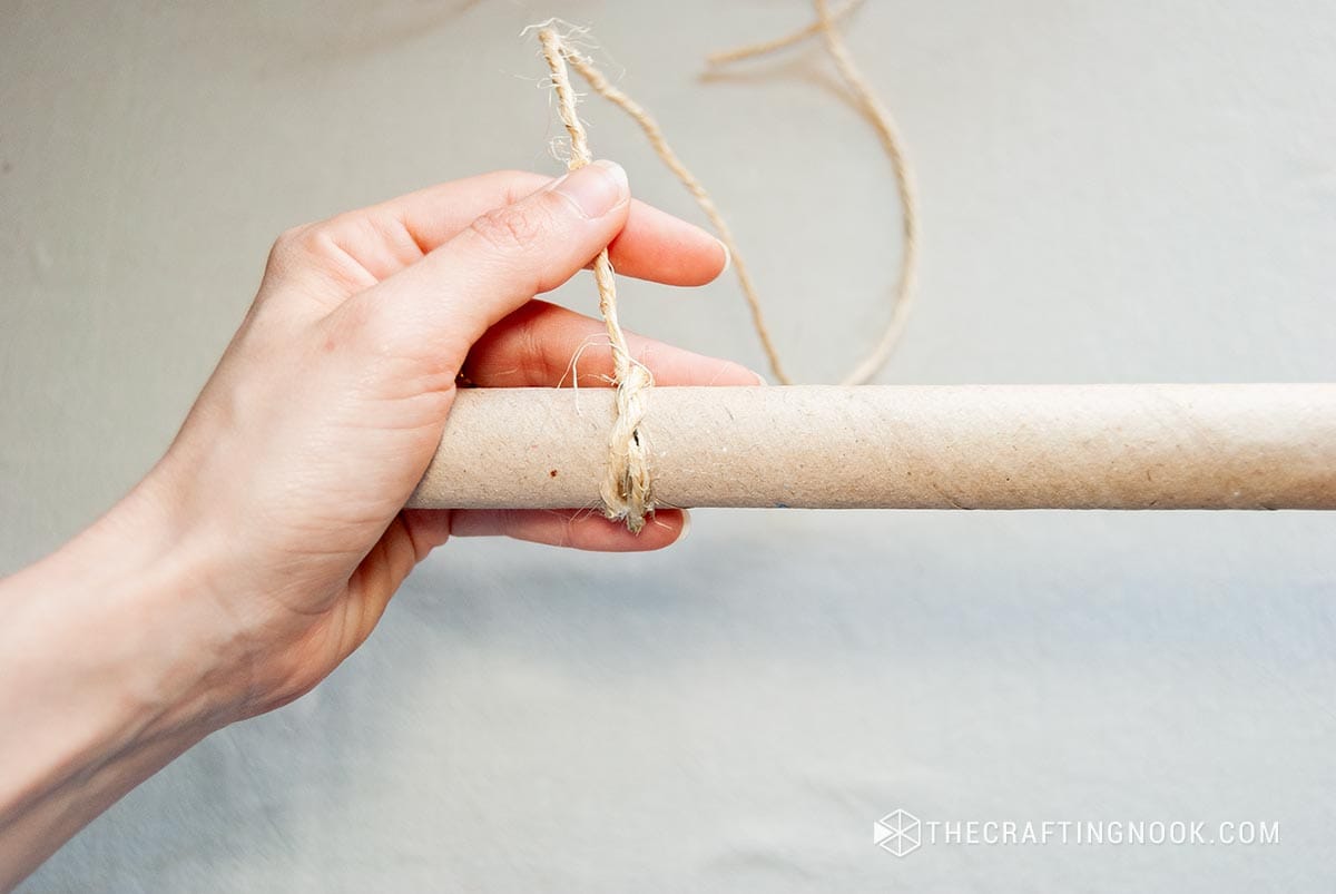 showing the knot attached to the paper tube