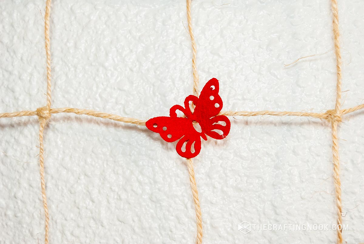 close up view of red felt butterfly on DYI hair clips holder
