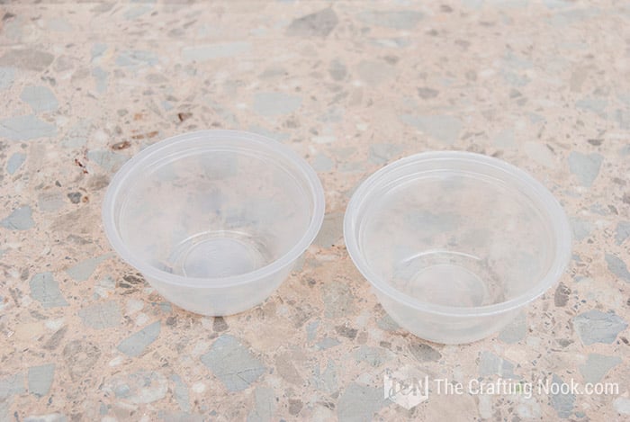 image of two small plastic containers
