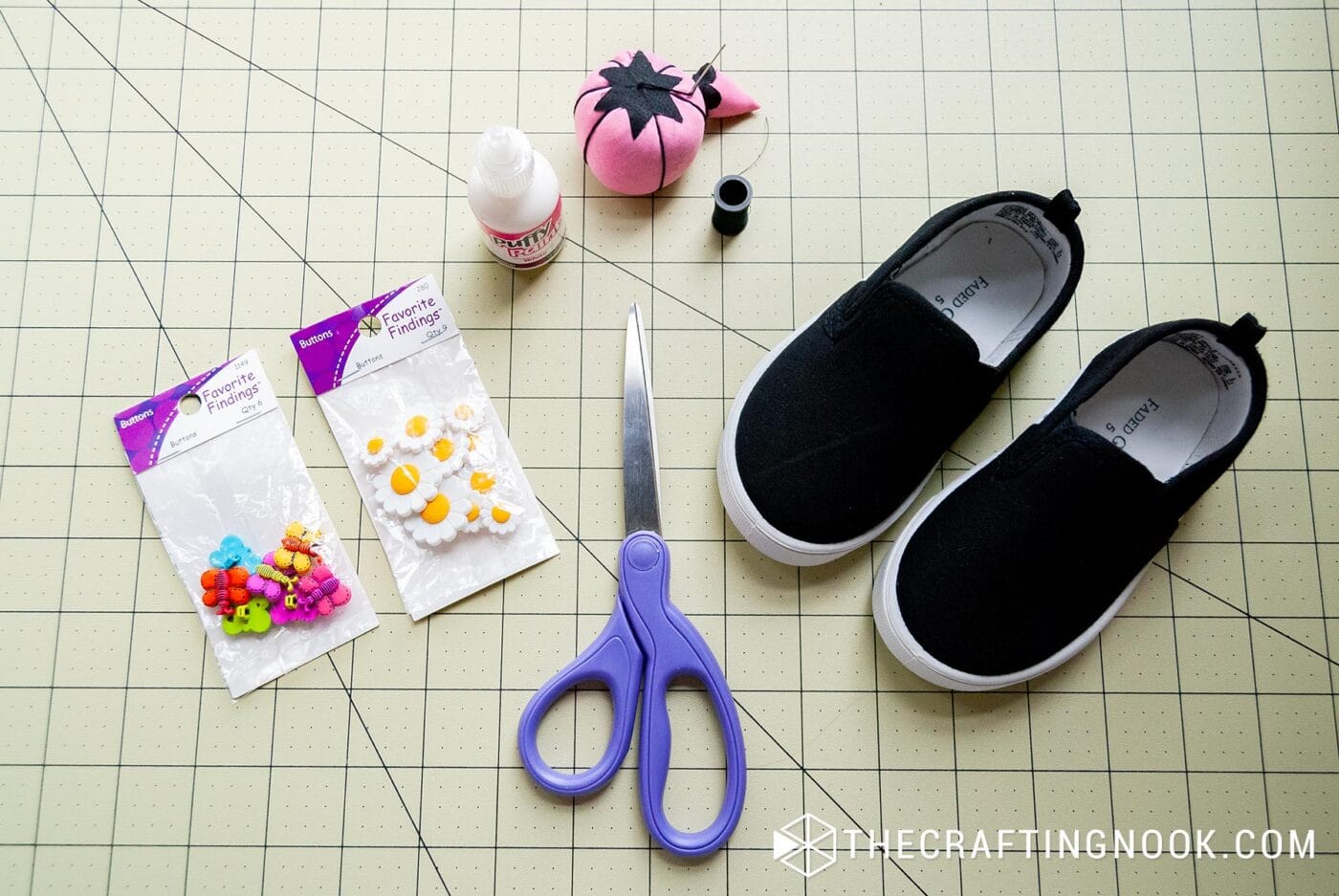 top view of all the supplies that will be usined tomake the diy embellished shoes