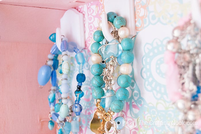 close up of crafty Jewelry organizer hanger with jewelry 