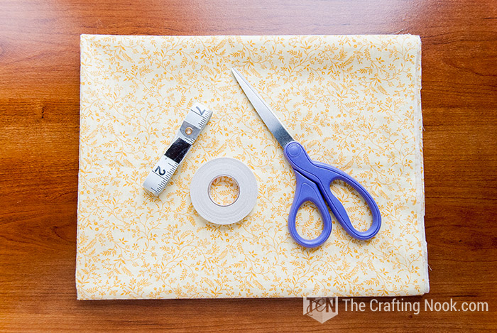 view of supplies neded to make the diy table runner no sew