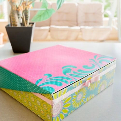 How to Mod Podge a Box with Scrapbook Paper showing the box closed on a table