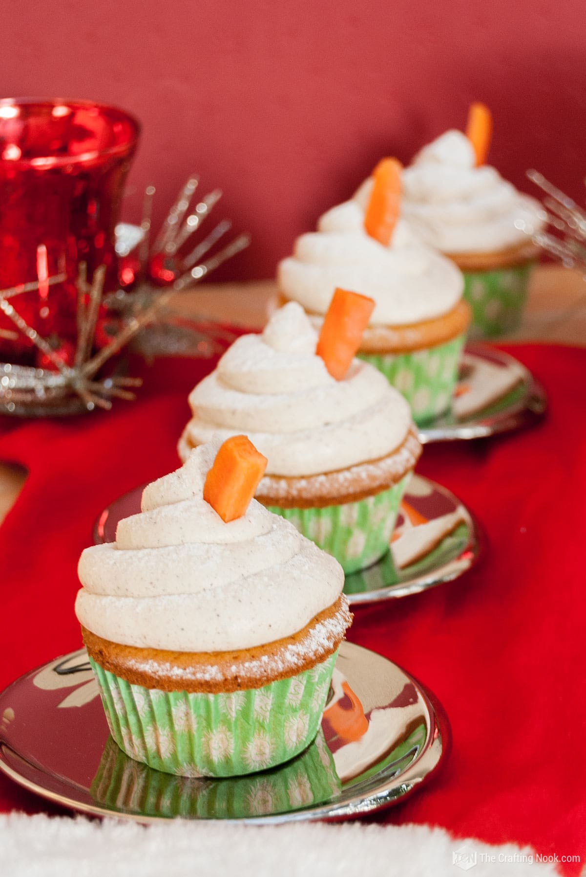 4 Carrot Cake Cupcakes with Cinnamon Buttercream Frosting in line