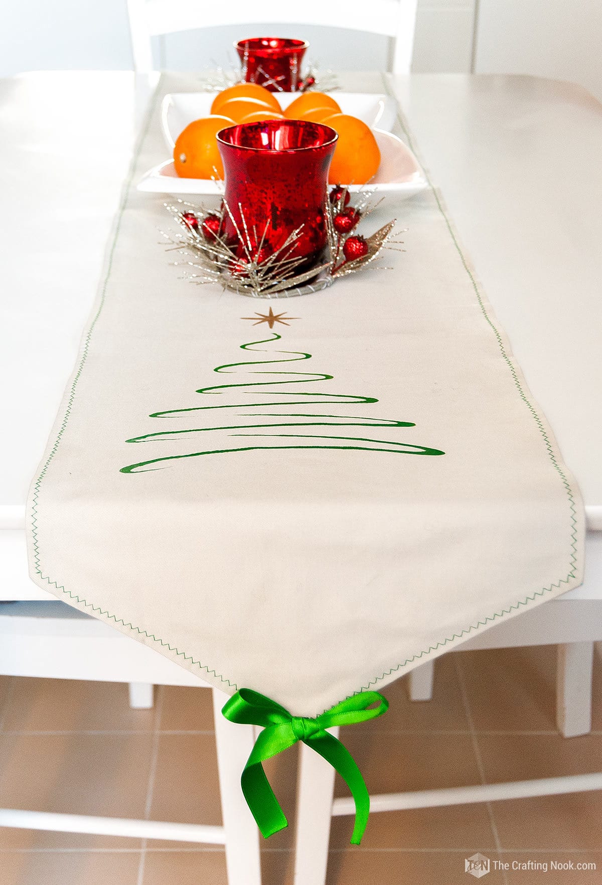 Perspective view of the table decorated with the DIY Stenciled Christmas Table Runner Pattern