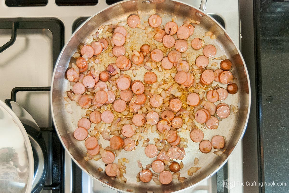 view of sausages cooking in the pan