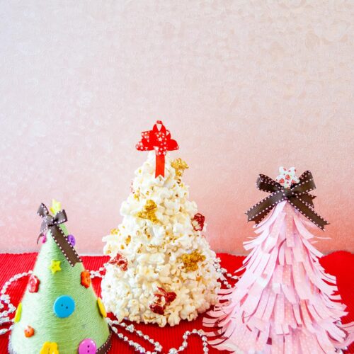 Diy Cone Christmas Trees with popcorn, yarn, and paper cover image