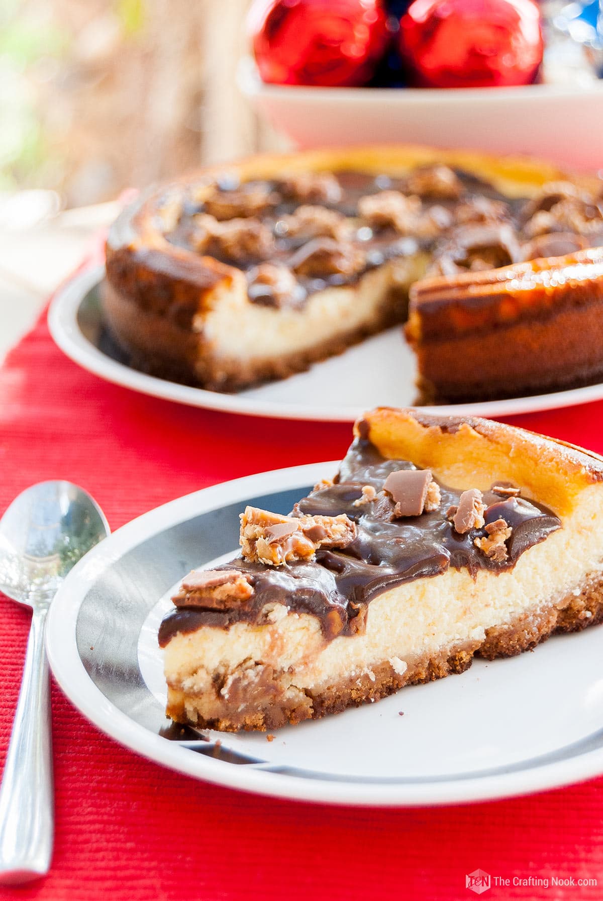 a slice of the Snickers Cheesecake on the table