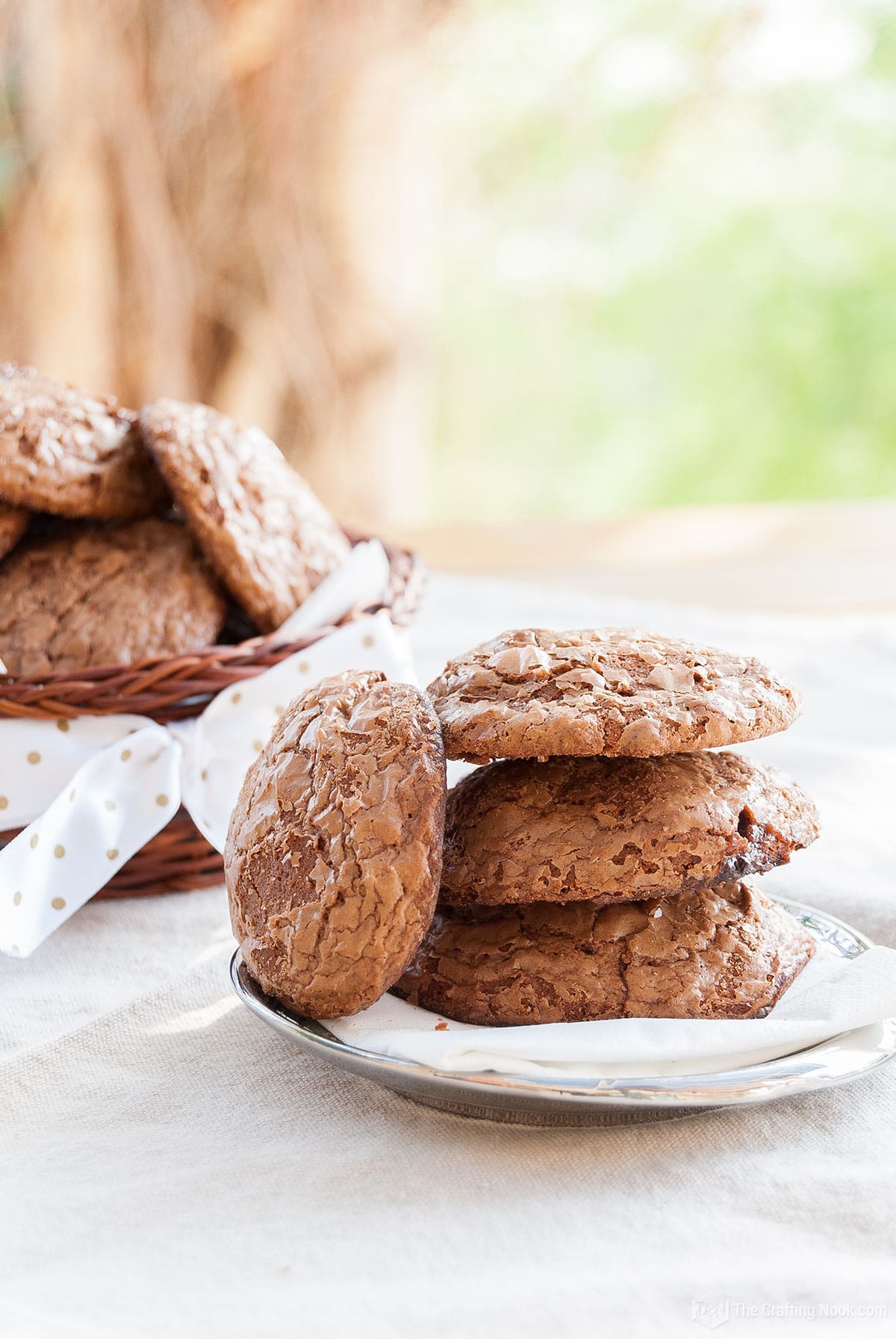 Brownie Batter Cookies with Mars Chocolate Bars piled up with one leaning on the side