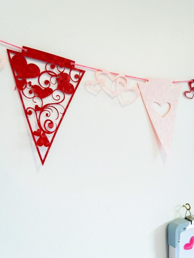 Cute and Easy DIY Valentine’s Day Buntings hangin on a white wall Cover image with Title text overlay