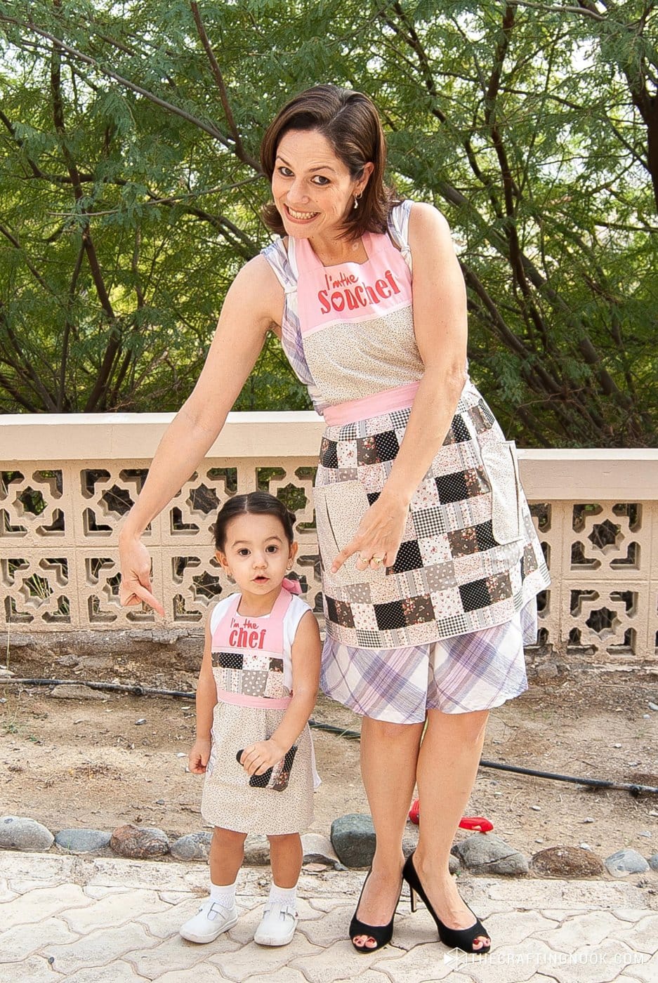 my daughter and I modeling the aprons