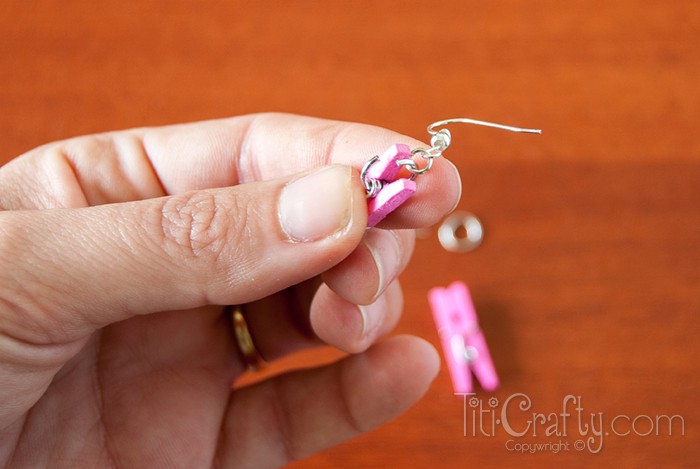 image of inserting Earring hook on the Mini clothespins