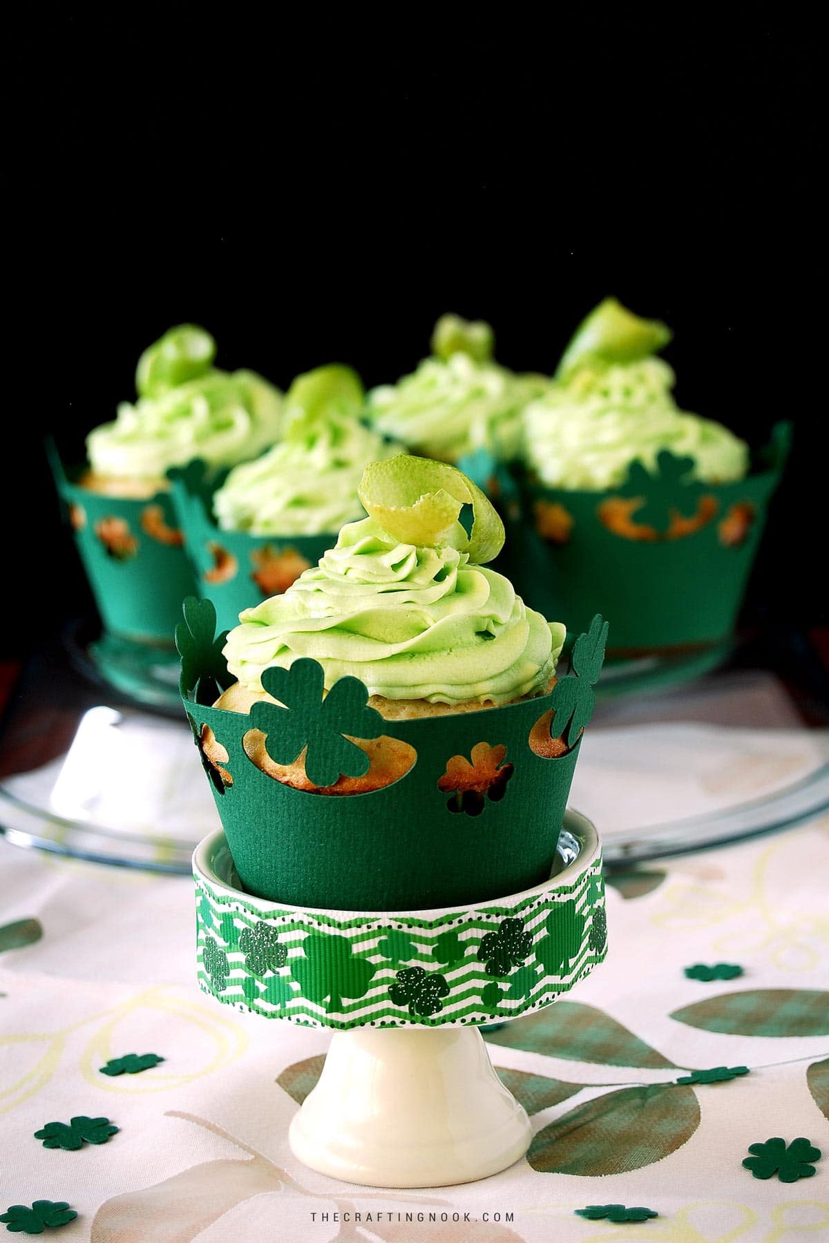 St. Patrick's Day Lime White Chocolate Chip Cupcakes with green buttercream frosting + Free cupcake liner files. Cover image.