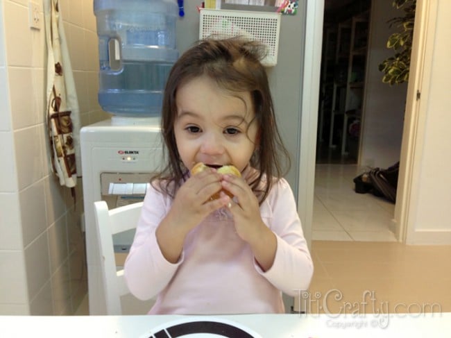 my daughter eating a delicious cupcake