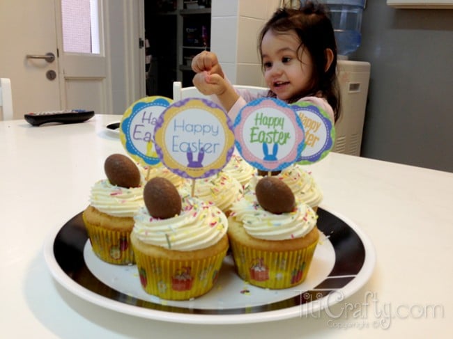 general view of the cupcakes and my daughter in the background playing