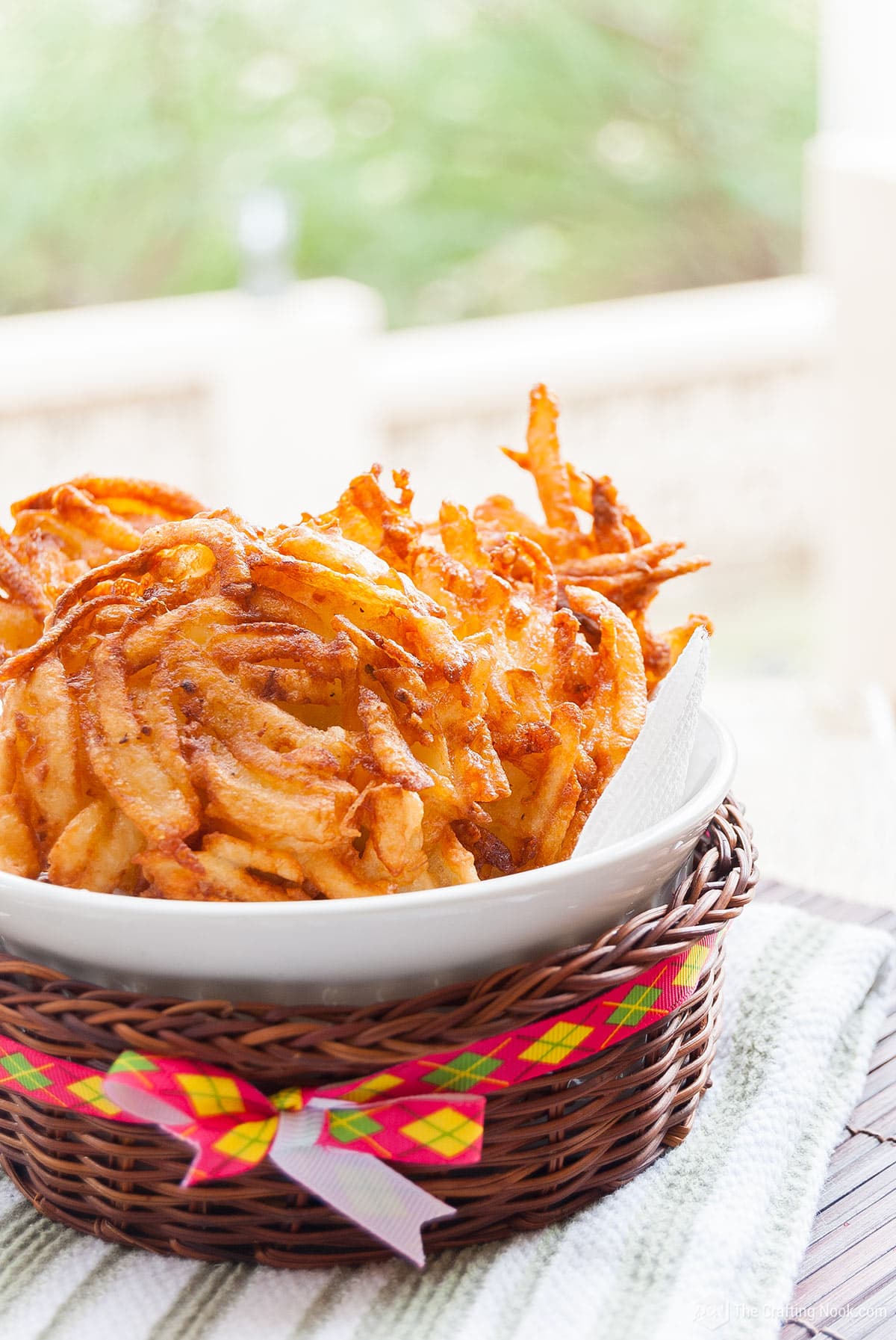 close view of the Crispy Homemade Hash Brown Patties in a dish inside a basket