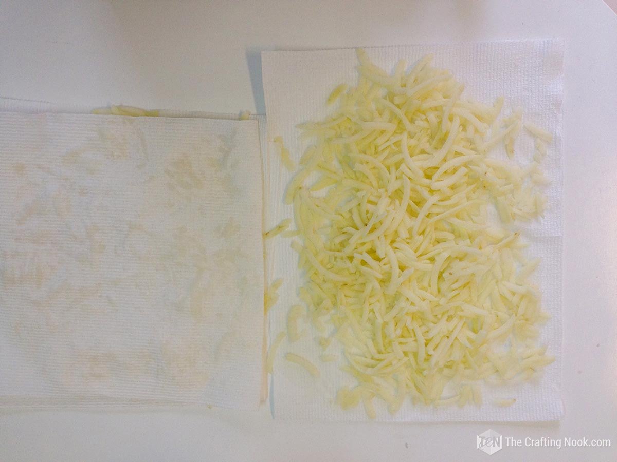 grated potatoes on paper towel