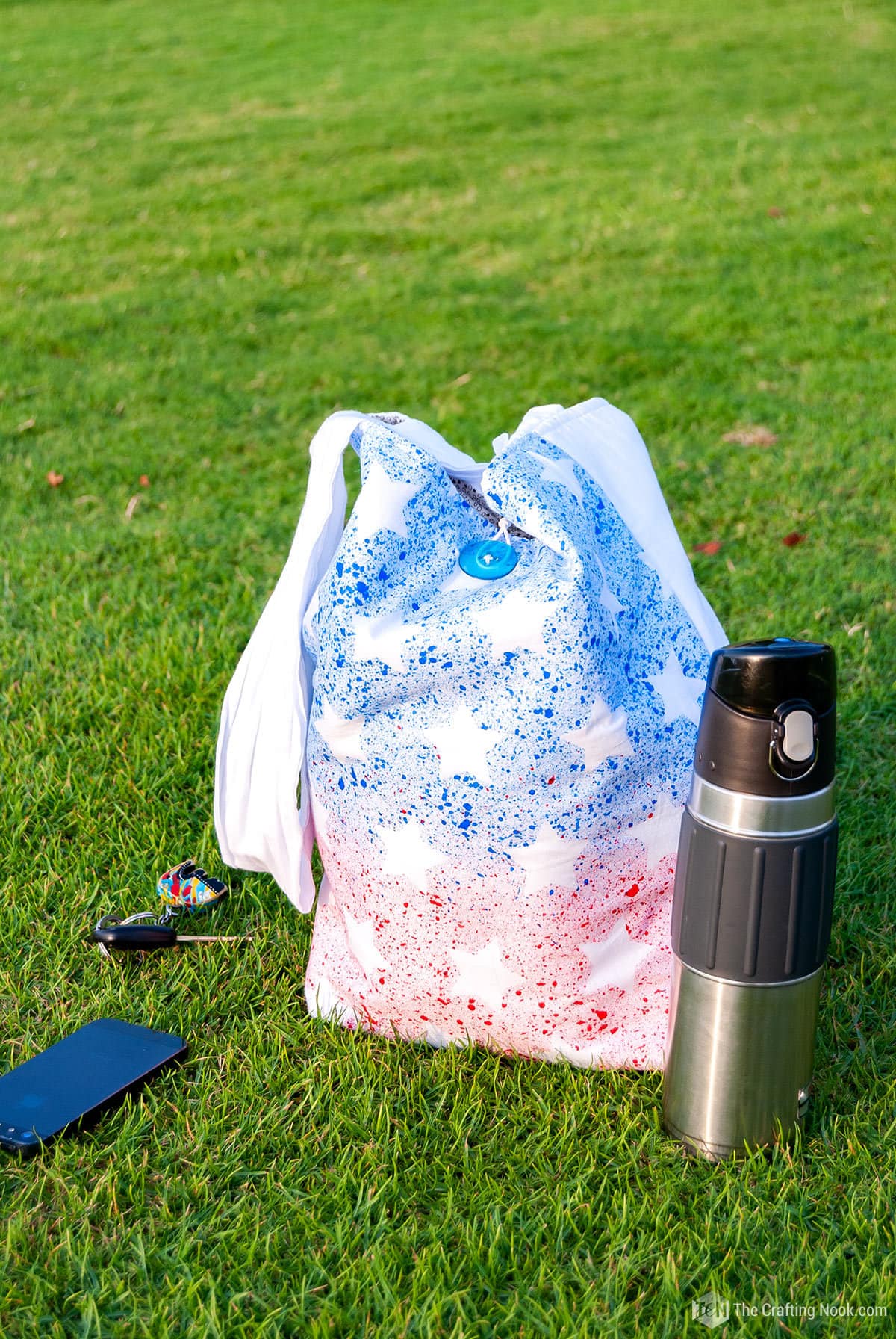 view DIY Patriotic Tote Bag with Toothbrush Painting on the grass