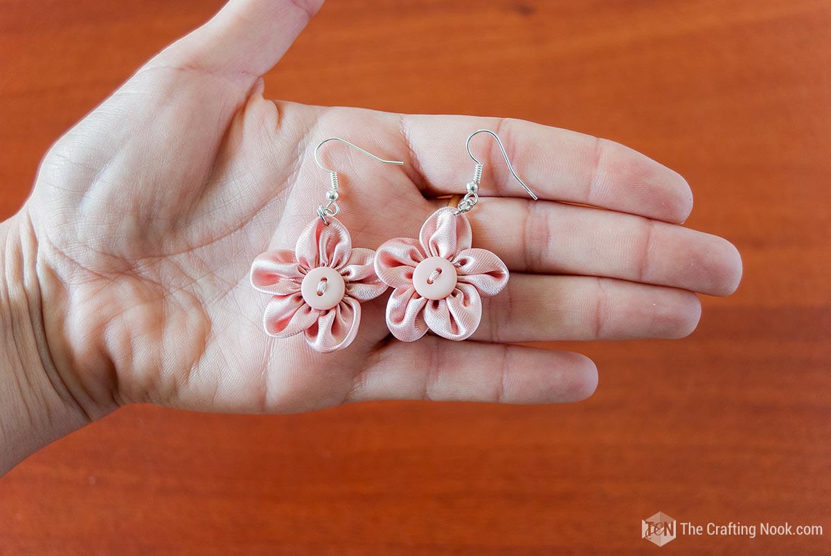 Showing finished earrings in hand
