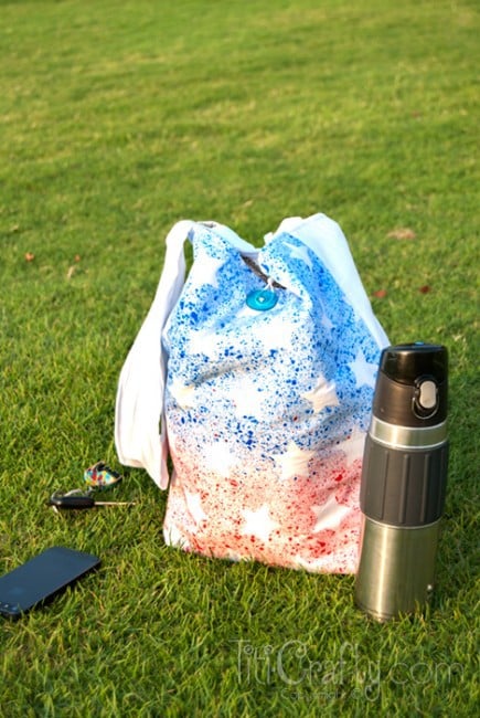 view DIY Paint Splattered Patriotic Tote Bag on grass