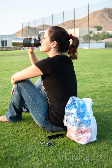 general view of me drinking water and with DIY Paint Splattered Patriotic Tote Bag