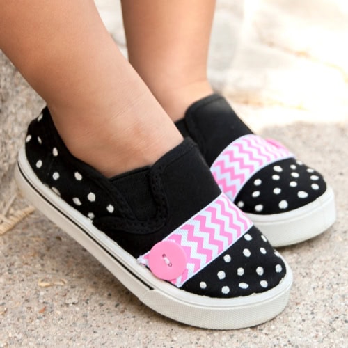 Kid wearing the DIY Polka Dot Painted Shoes for Kids Using Puffy Paint. Feature image