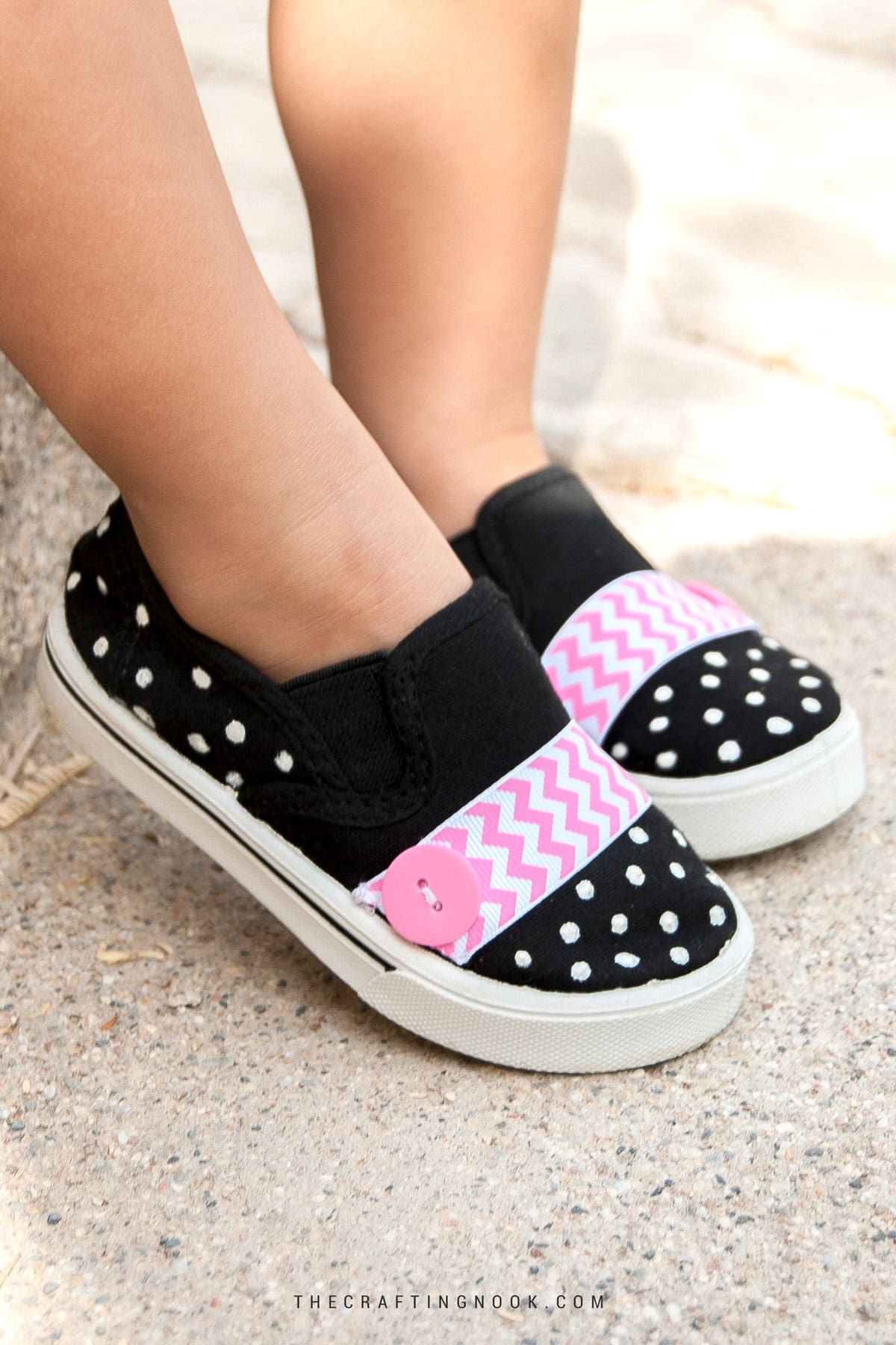 Kid wearing the DIY Polka Dot Painted Shoes for Kids Using Puffy Paint. Feature image