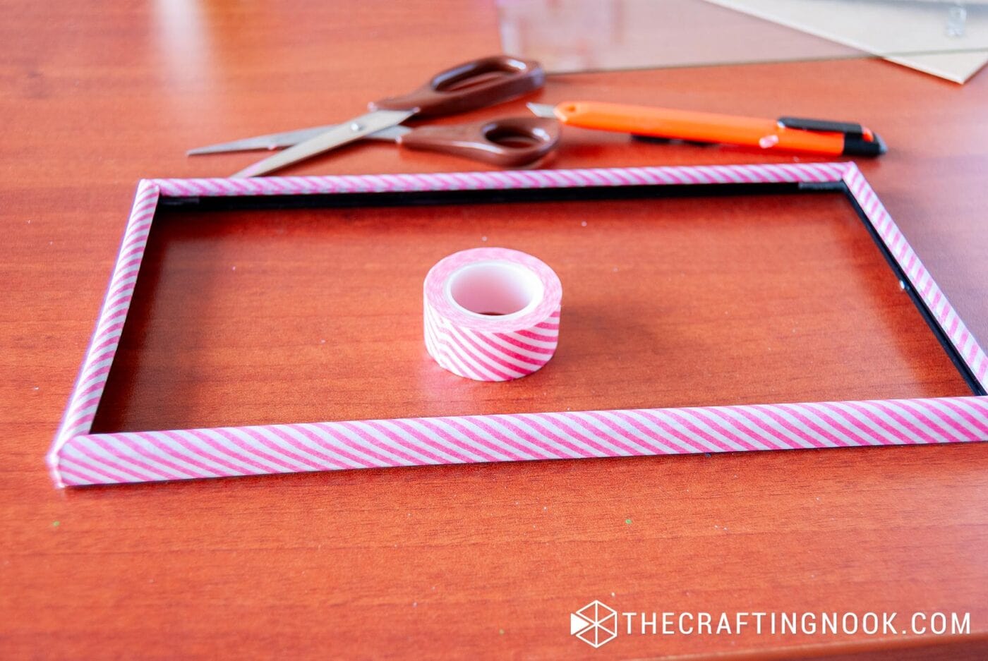 perspective view of a photo frame frame lined with washi tape
