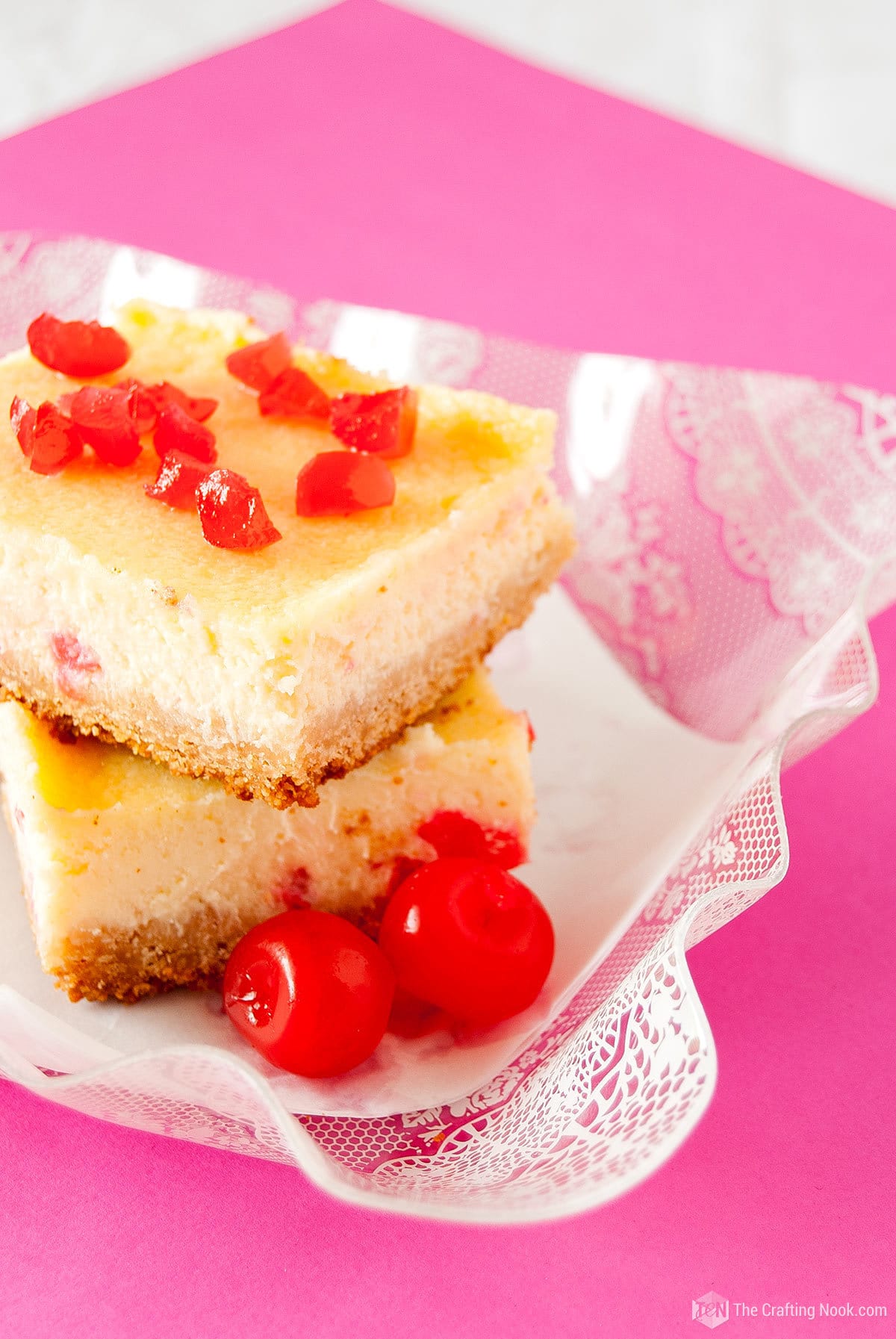 closeup stack of two White Chocolate Cherry Cheesecake Bars