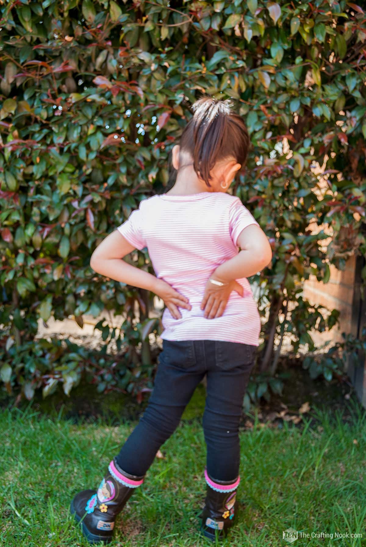 A Girl waring the DIY Turning Onesies into T-Shirts