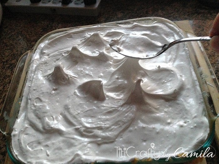 spoon making peaks on the meringue