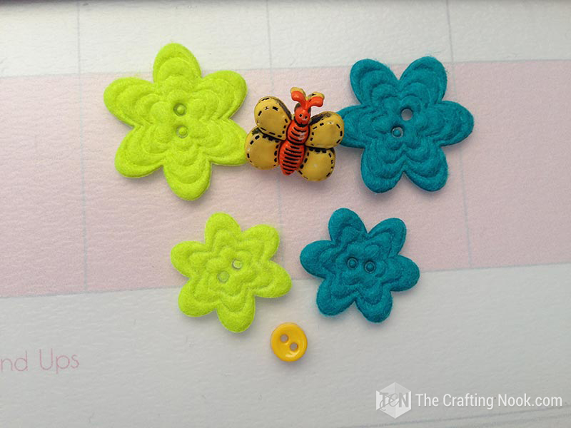 view of some appliques such as buttons and some cute flowers