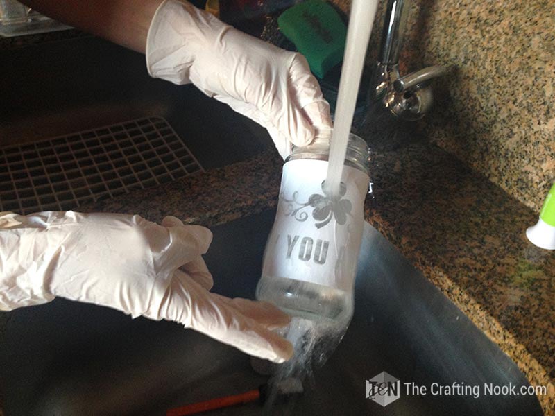 washing the glass under running water