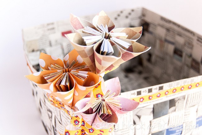 close up of Newspaper Basket Paper-Flowers in the corner of basket