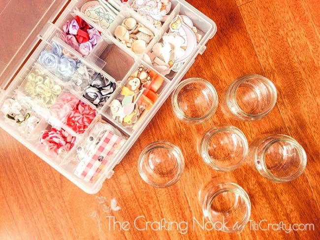 top view of small recycled jars and a box with decorative threads