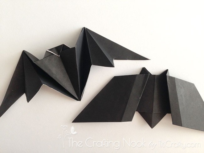 Two origami black bats