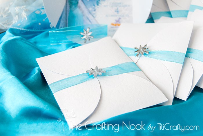 close up of Frozen Themed Party Invitations closed with snowflake button
