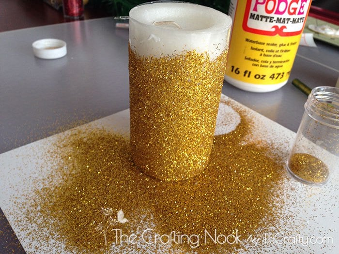 close up view of the candle with glitter and excess on the table