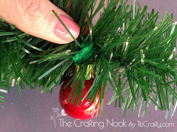 closeup of christmas ball on christmas grass garland