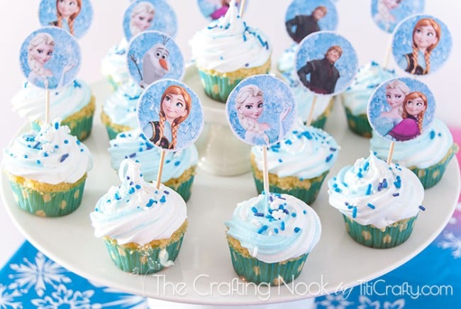 angled top view of various cupcakes decorated with the Frozen theme
