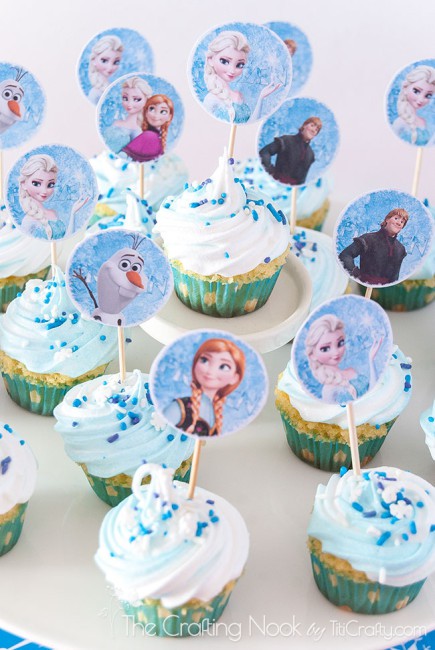 angled top vertical image of various cupcakes decorated with the Frozen theme
