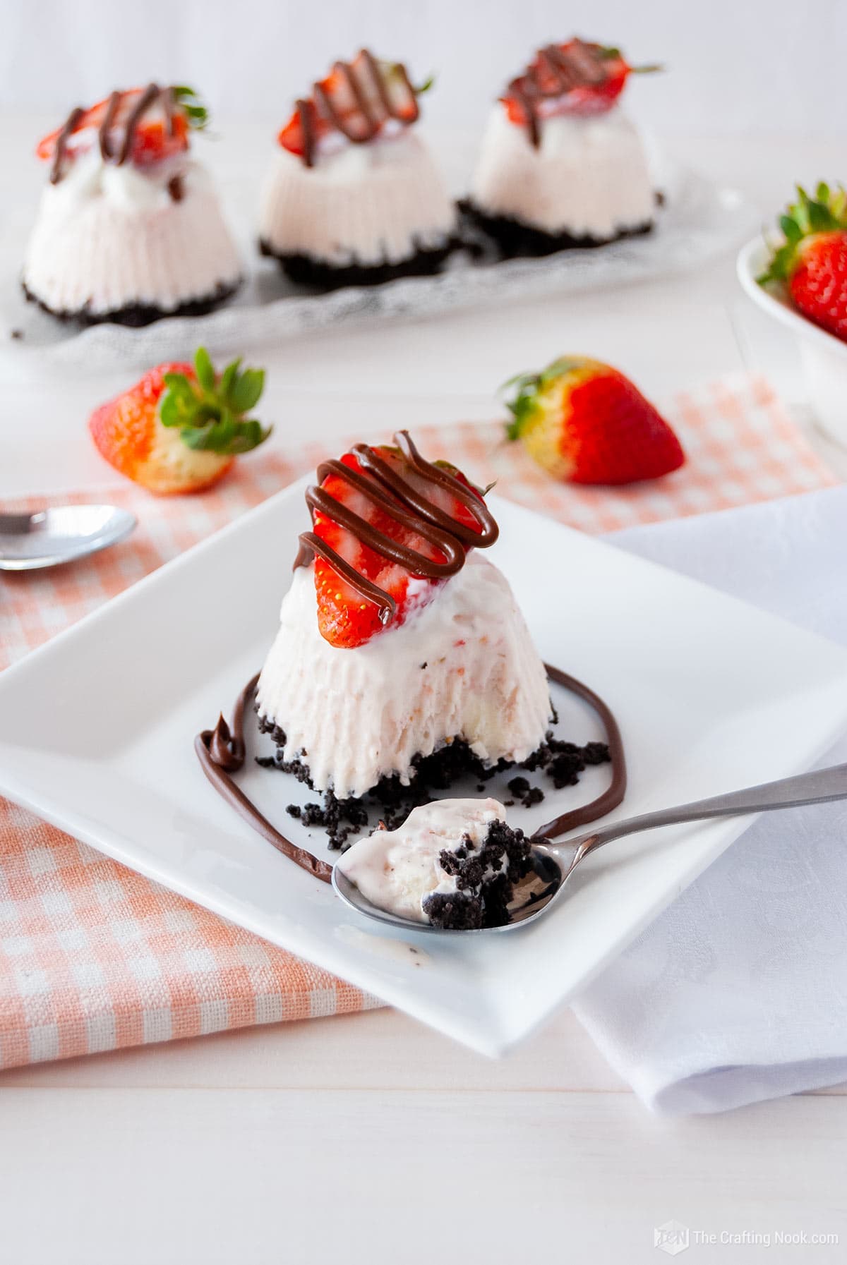 45 degree angle shot of one Individual Frozen Oreo Strawberry Pie with a spoonful of dessert