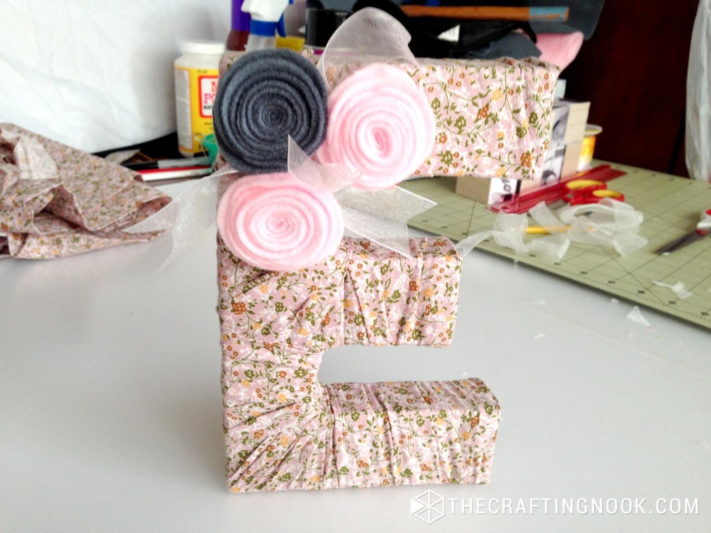 Cute DIY Fabric Covered Letters with flowers on the table